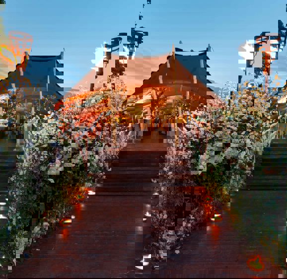 Outdoor wedding setting including canopy to host guests under Outdoor wedding setting including canopy to host guests under