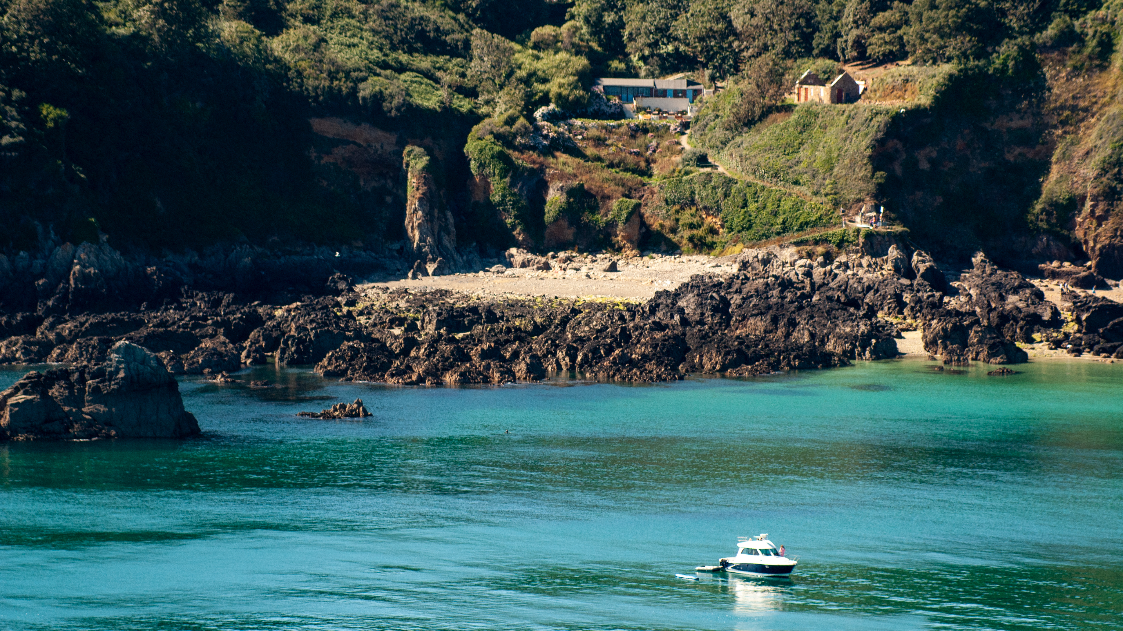 Moulin Huet Bay with boat in Guernsey