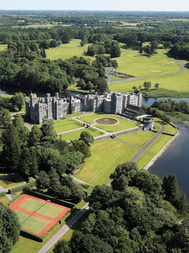 Exterior of Ashford Castle hotel located in Ireland Exterior of Ashford Castle hotel located in Ireland