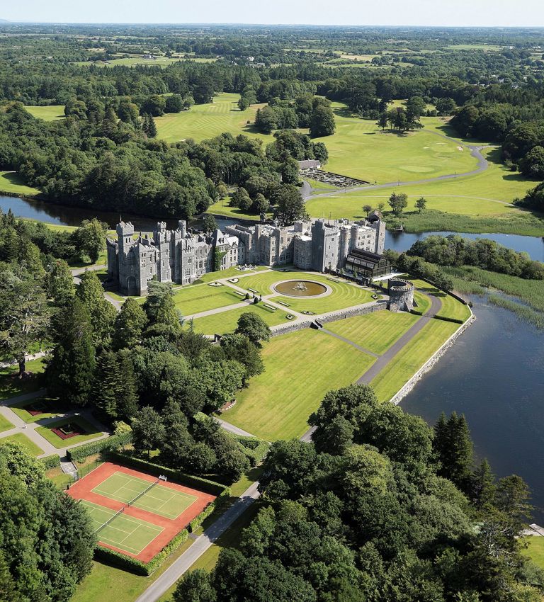 Exterior of Ashford Castle hotel located in Ireland Exterior of Ashford Castle hotel located in Ireland