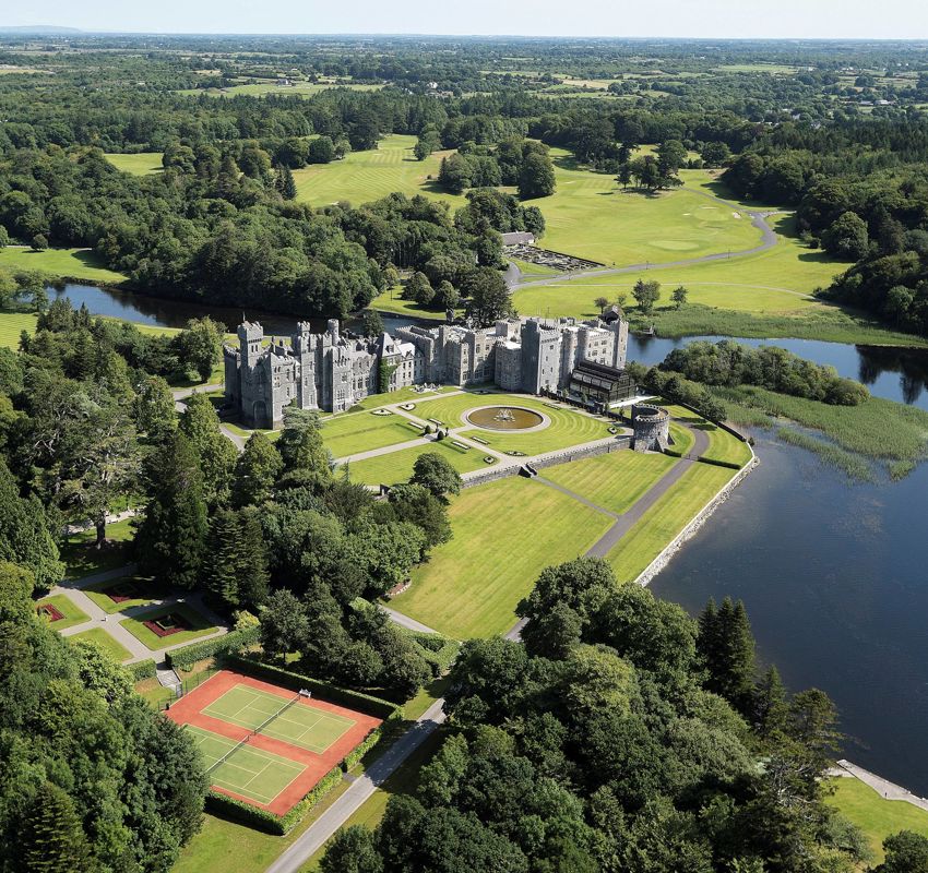Exterior of Ashford Castle hotel located in Ireland Exterior of Ashford Castle hotel located in Ireland