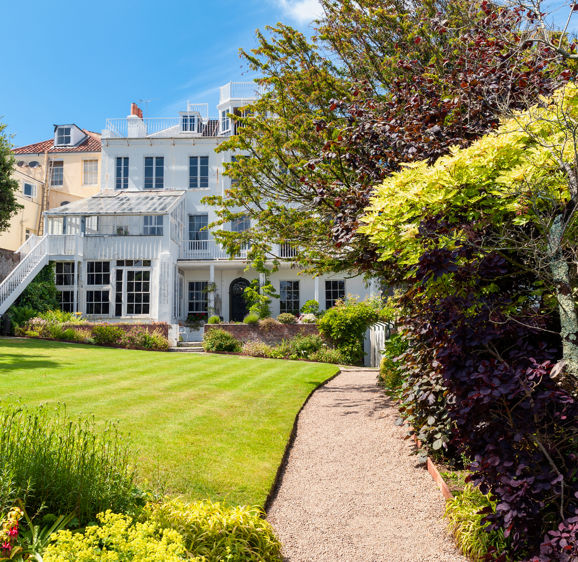 Hauteville House in Saint Peter Port, Guernsey, Channel Islands, UK on July 5, 2013. Famous french poet Victor Hugo used to live here in the 19th Century. Hauteville House in Saint Peter Port, Guernsey, Channel Islands, UK on July 5, 2013. Famous french poet Victor Hugo used to live here in the 19th Century.