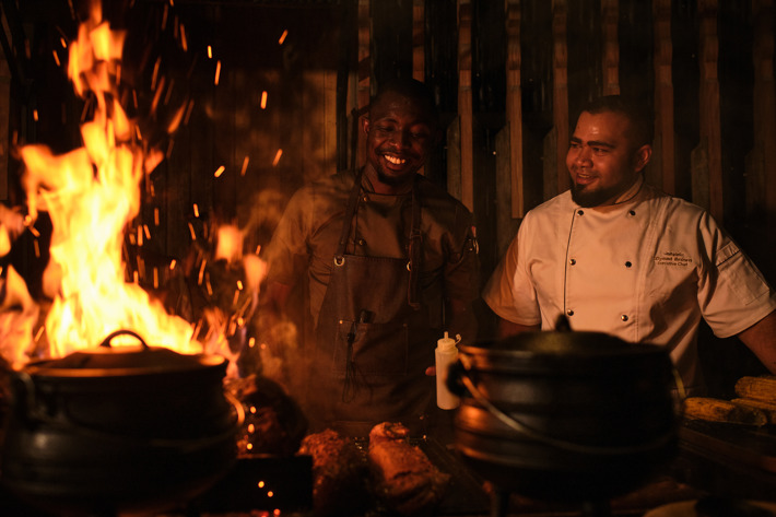 Ziyaad Brown cooking with fire at the Xigera Boma