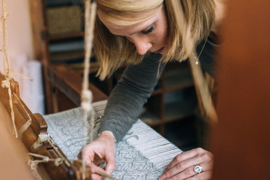 Woman at weaving table