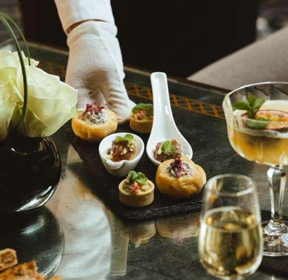 Enjoy complimentary canapés Enjoy complimentary canapés