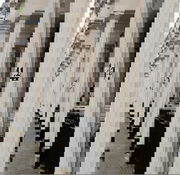 Cream pillars outside Belgravia home Cream pillars outside Belgravia home