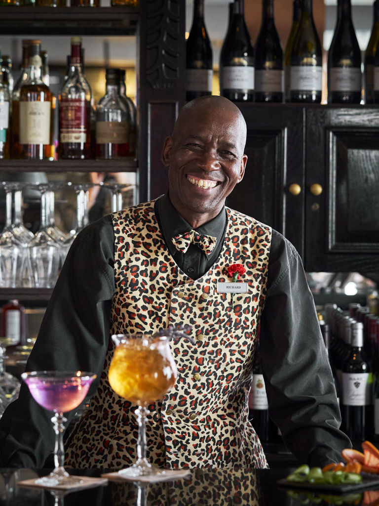 Twelve Apostles Leopard Bar Barman serving cocktails Twelve Apostles Leopard Bar Barman serving cocktails
