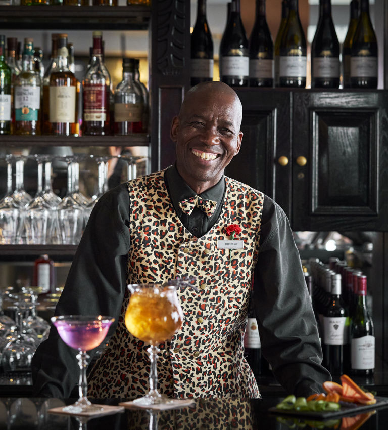 Twelve Apostles Leopard Bar Barman serving cocktails Twelve Apostles Leopard Bar Barman serving cocktails