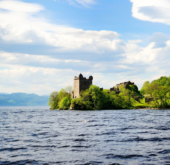 View of Urquhart Castle and Loch Ness in the Highlands of Scotland View of Urquhart Castle and Loch Ness in the Highlands of Scotland