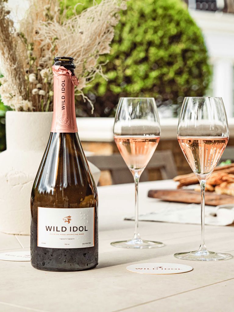Bottle and poured glasses of Wild Idol alcohol-free sparkling rosé Bottle and poured glasses of Wild Idol alcohol-free sparkling rosé