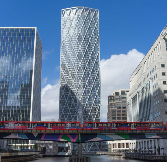 Skyscraper in Canary Wharf with a Docklands Light Railway train below Skyscraper in Canary Wharf with a Docklands Light Railway train below