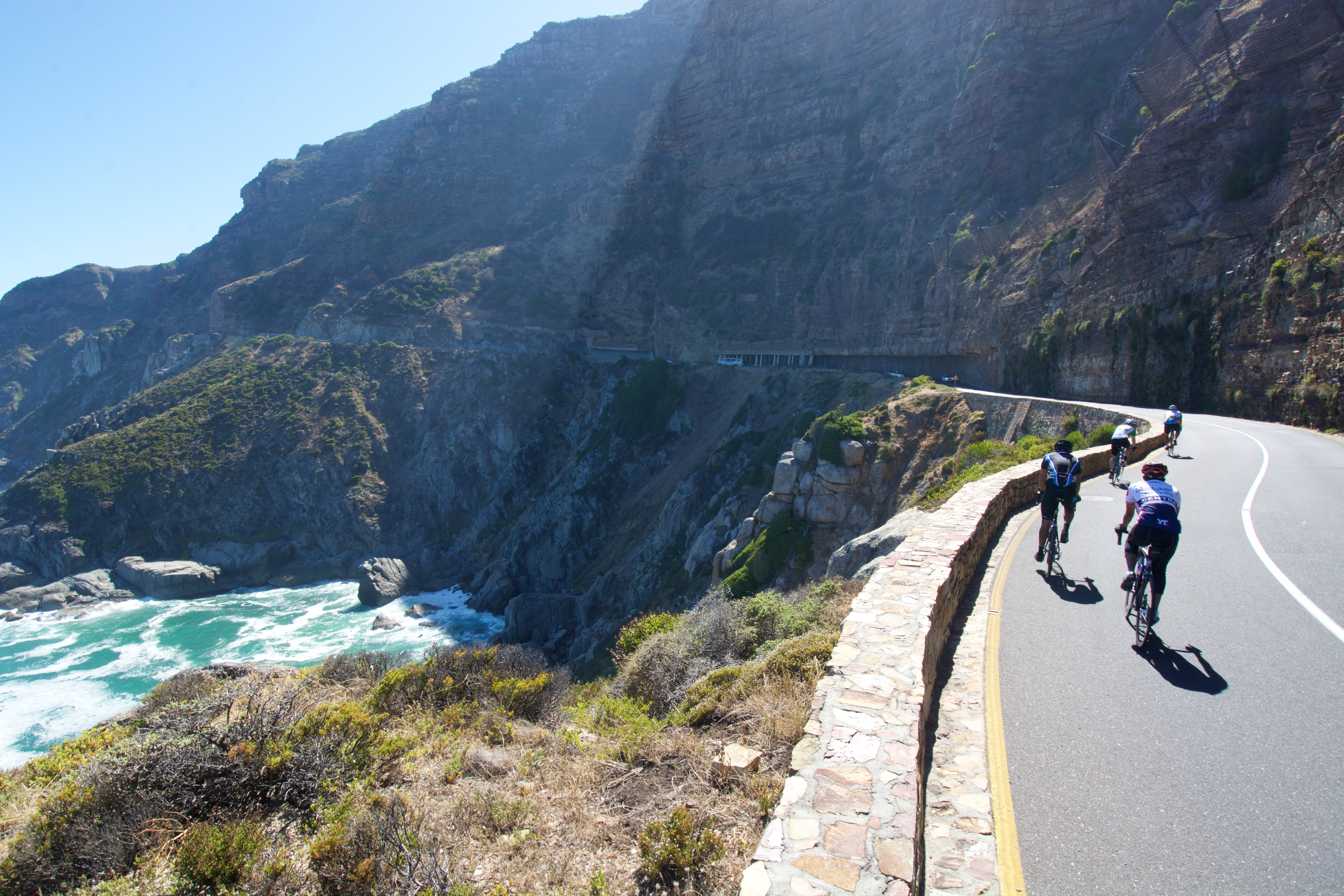 Cyclists practice for Argus Cycle Tour along Chapman's Peak Pass.