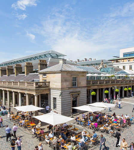 View of Covent Garden market in London. Covent Garden - one of the main tourist attractions in London - is known for its restaurants, pubs, market stalls and shops View of Covent Garden market in London. Covent Garden - one of the main tourist attractions in London - is known for its restaurants, pubs, market stalls and shops
