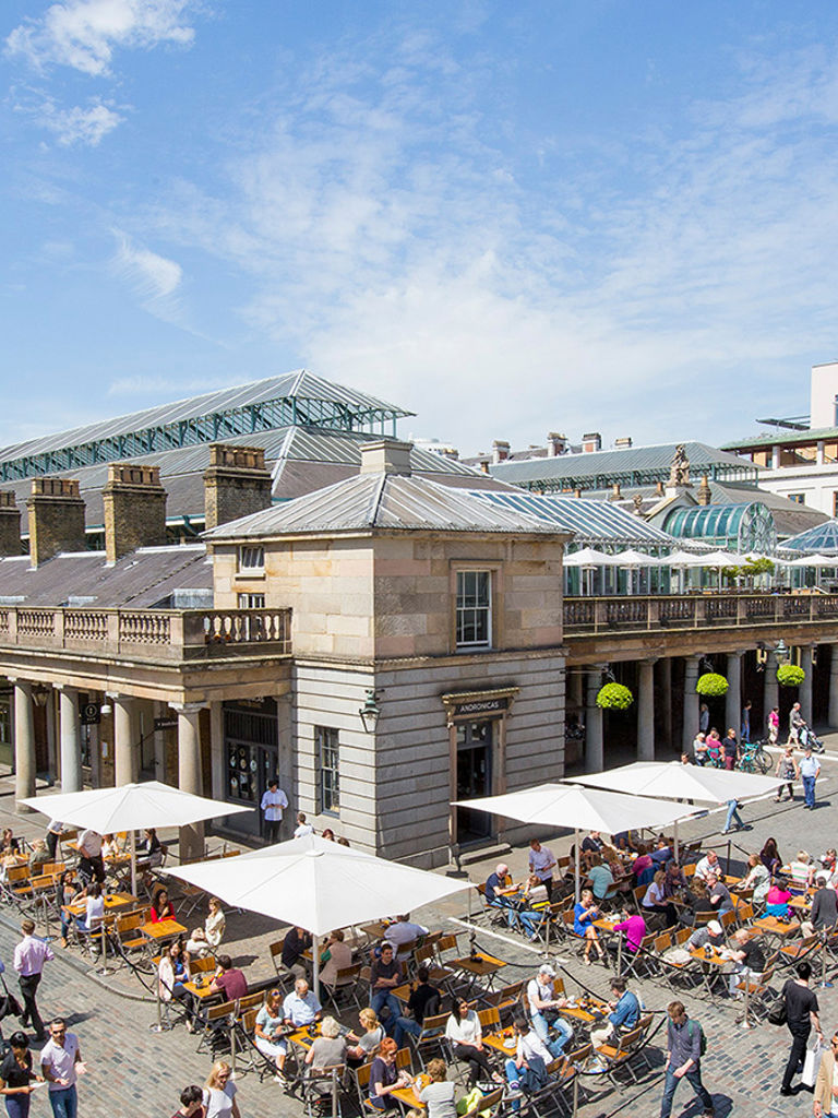View of Covent Garden market in London. Covent Garden - one of the main tourist attractions in London - is known for its restaurants, pubs, market stalls and shops View of Covent Garden market in London. Covent Garden - one of the main tourist attractions in London - is known for its restaurants, pubs, market stalls and shops