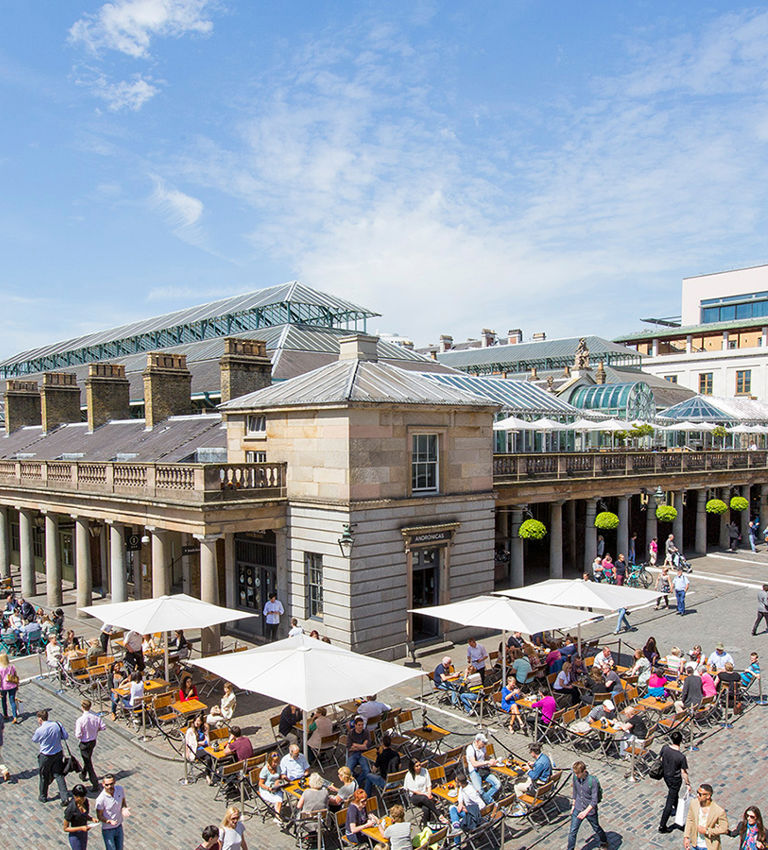 View of Covent Garden market in London. Covent Garden - one of the main tourist attractions in London - is known for its restaurants, pubs, market stalls and shops View of Covent Garden market in London. Covent Garden - one of the main tourist attractions in London - is known for its restaurants, pubs, market stalls and shops