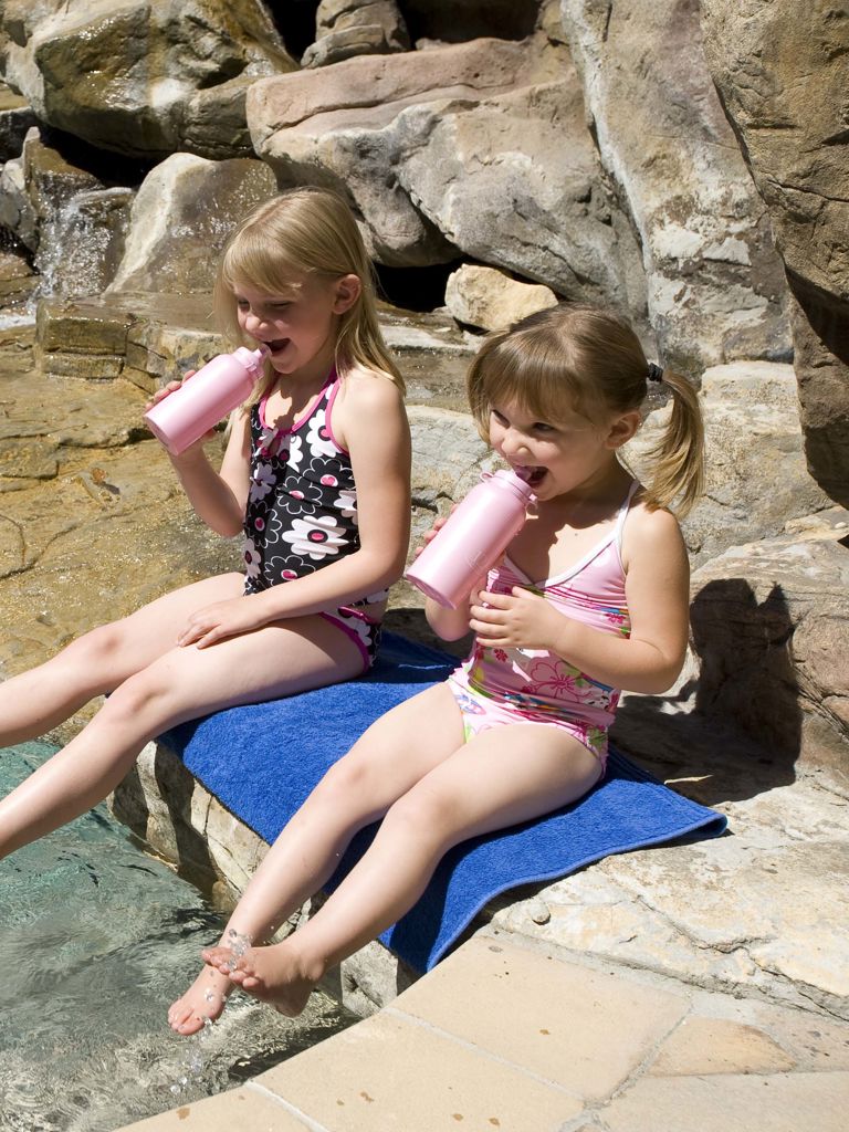 Girl drinking milkshakes with thier feet in the water at the rock pools at The Twelve Apostles Hotel Girl drinking milkshakes with thier feet in the water at the rock pools at The Twelve Apostles Hotel