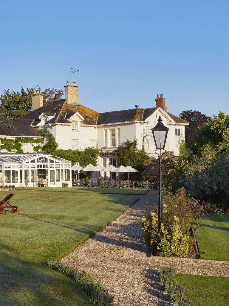 Summer Lodge Exterior with loungers Summer Lodge Exterior with loungers