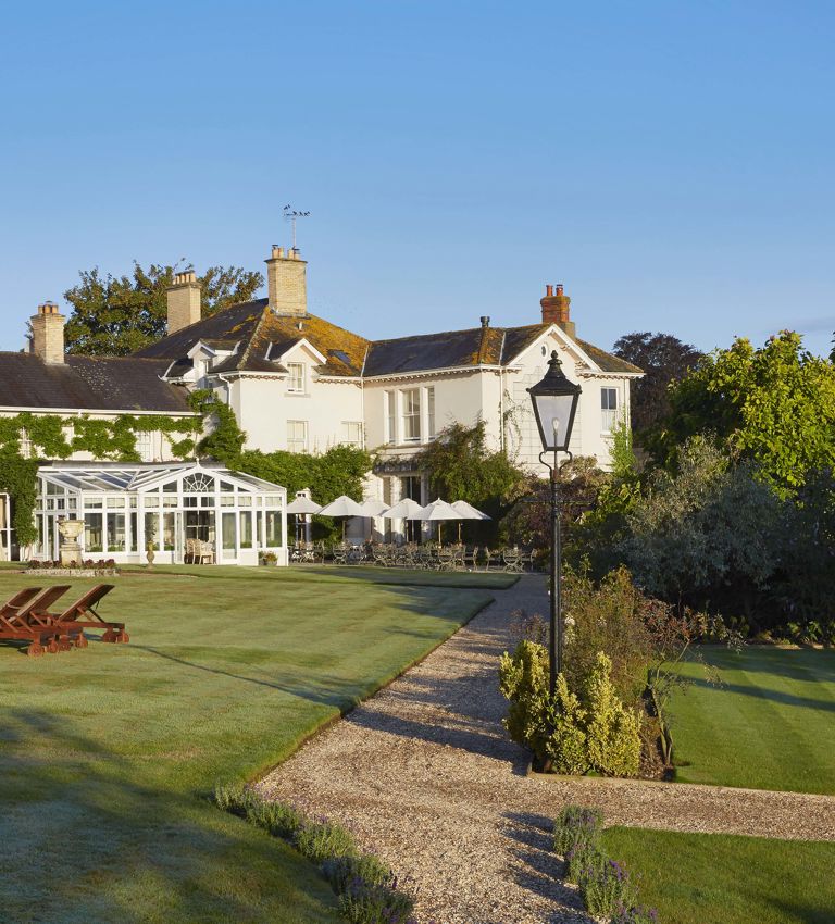 Summer Lodge Exterior with loungers Summer Lodge Exterior with loungers