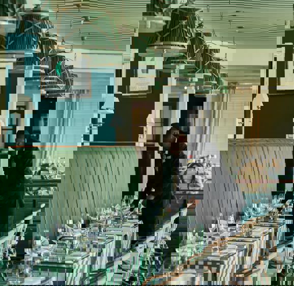 Tables being set in the Brasserie Restaurant Tables being set in the Brasserie Restaurant