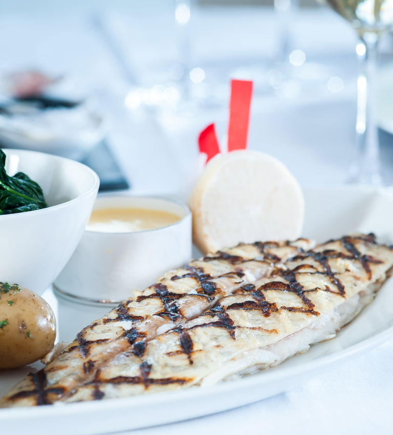 Dover Sole accompanied by potatoes Dover Sole accompanied by potatoes