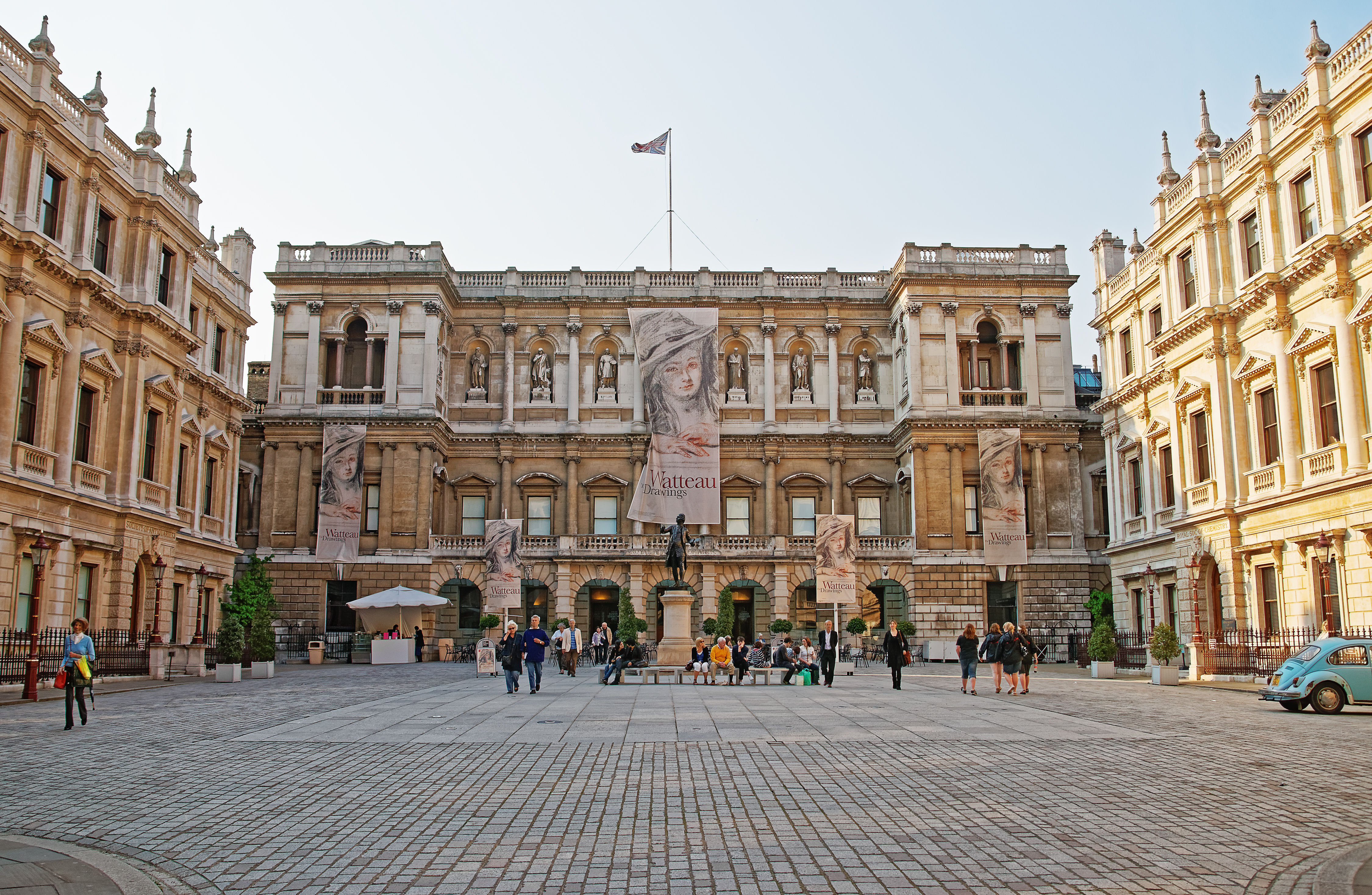 Royal Academy of Arts on Piccadilly, at Burlington House, in London, the UK. Tourists on the background.
