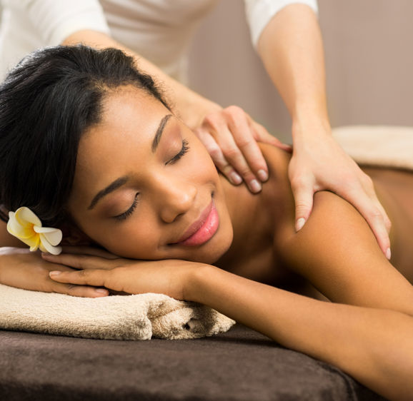 Closeup of woman receiving back massage Closeup of woman receiving back massage