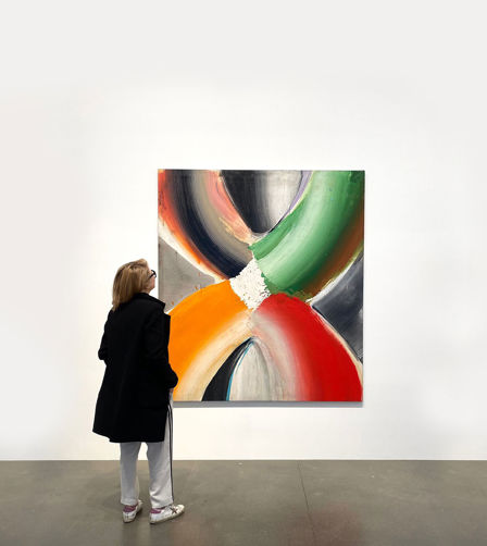 women looking at artwork women looking at artwork