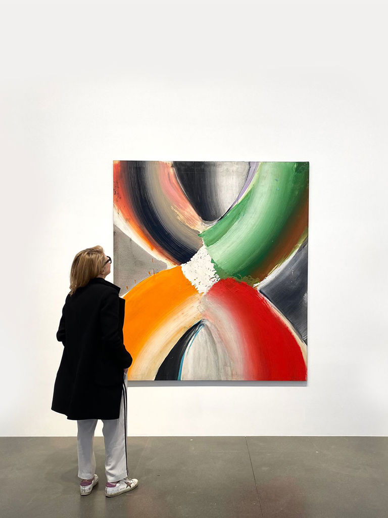 women looking at artwork women looking at artwork