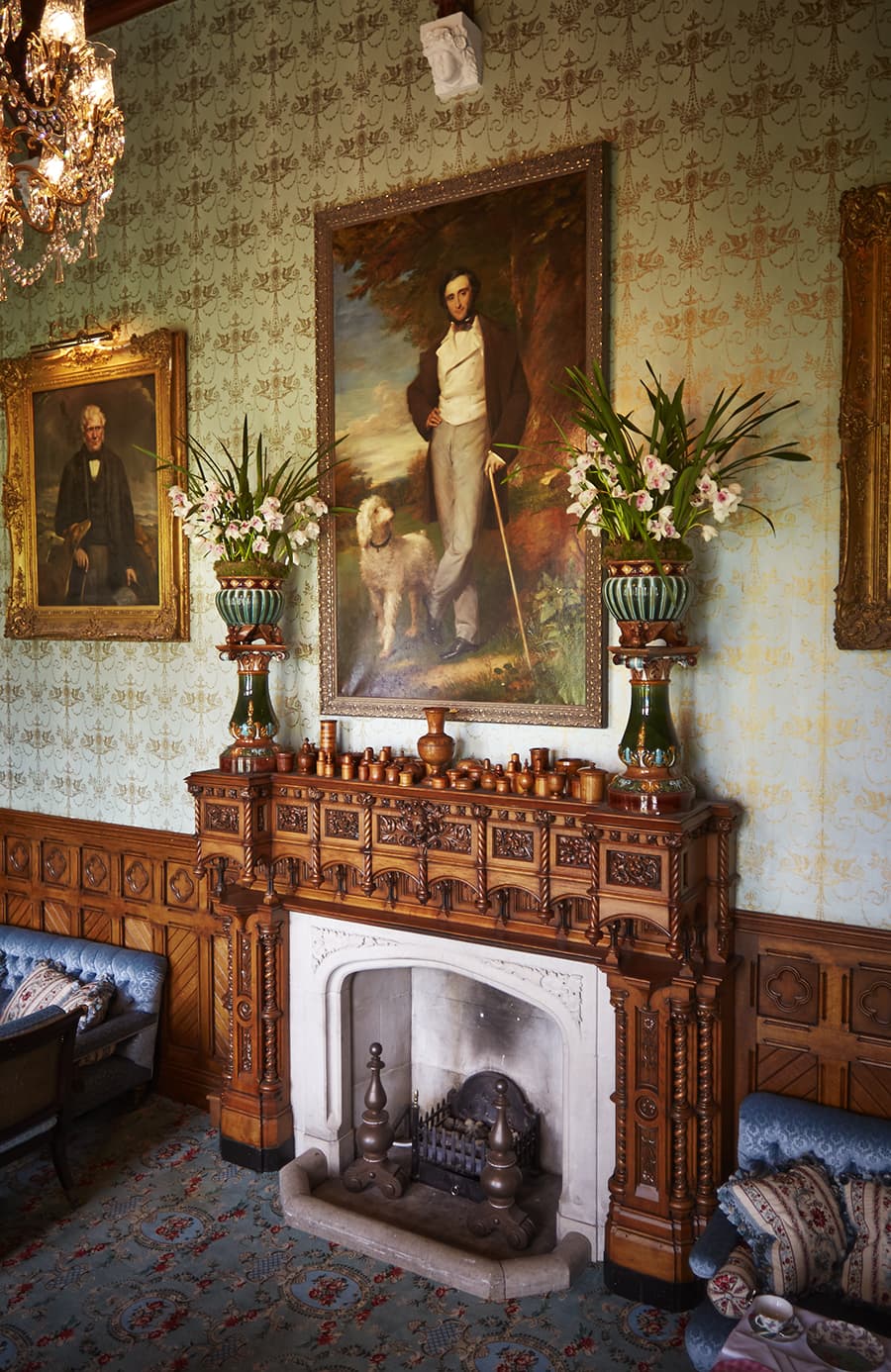 Fireplace with a grand painting of a duke above the fireplace in the Connaught Room at Ashford Casle
