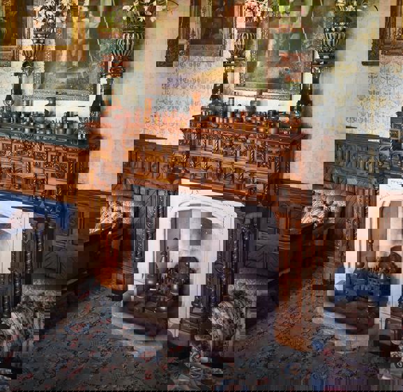 Fireplace with a grand painting of a duke above the fireplace in the Connaught Room at Ashford Casle Fireplace with a grand painting of a duke above the fireplace in the Connaught Room at Ashford Casle