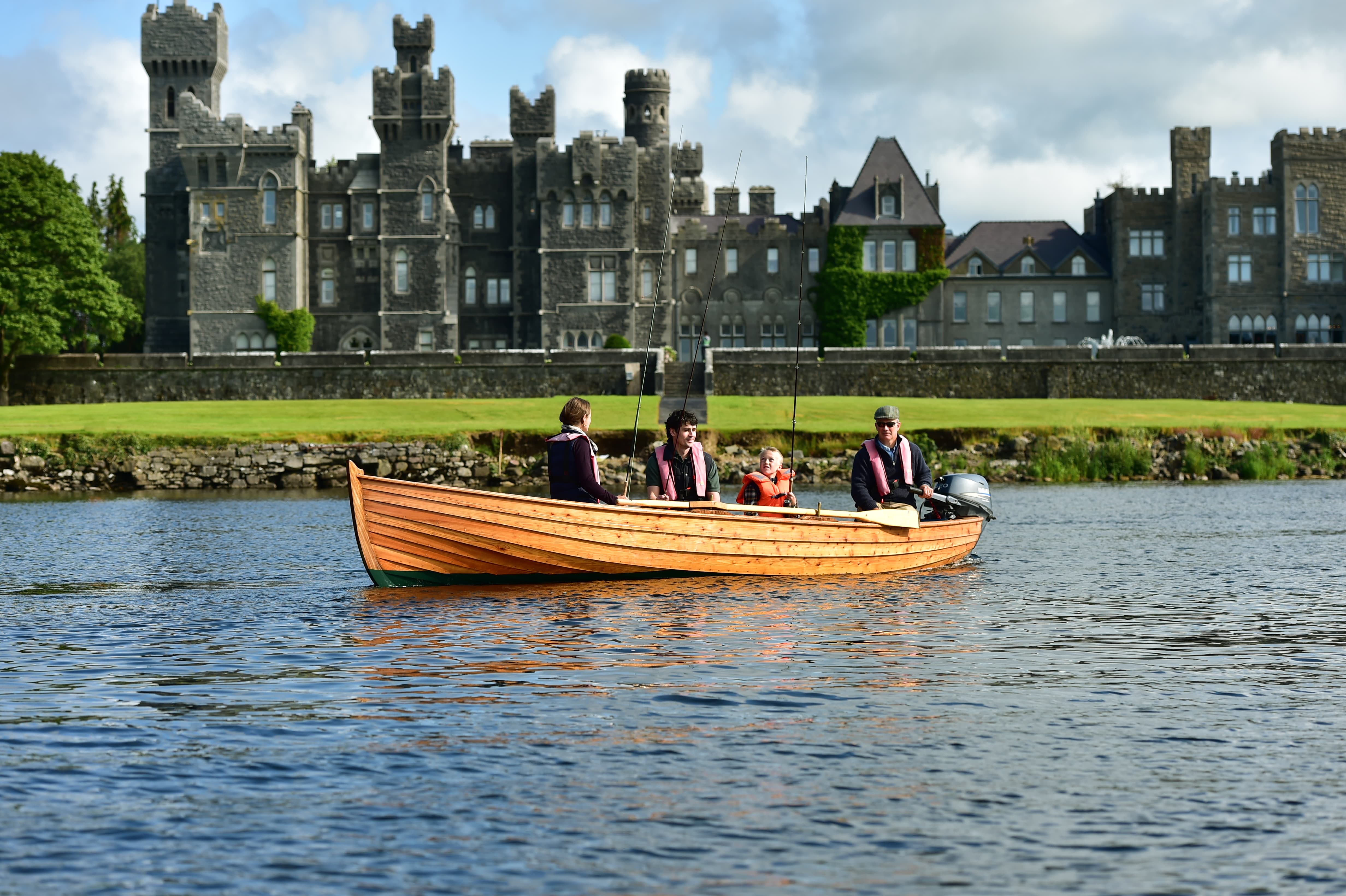 Family fishing on a boat at Ashford Castle