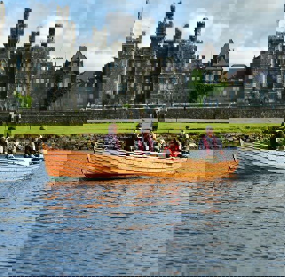 Family fishing on a boat at Ashford Castle Family fishing on a boat at Ashford Castle