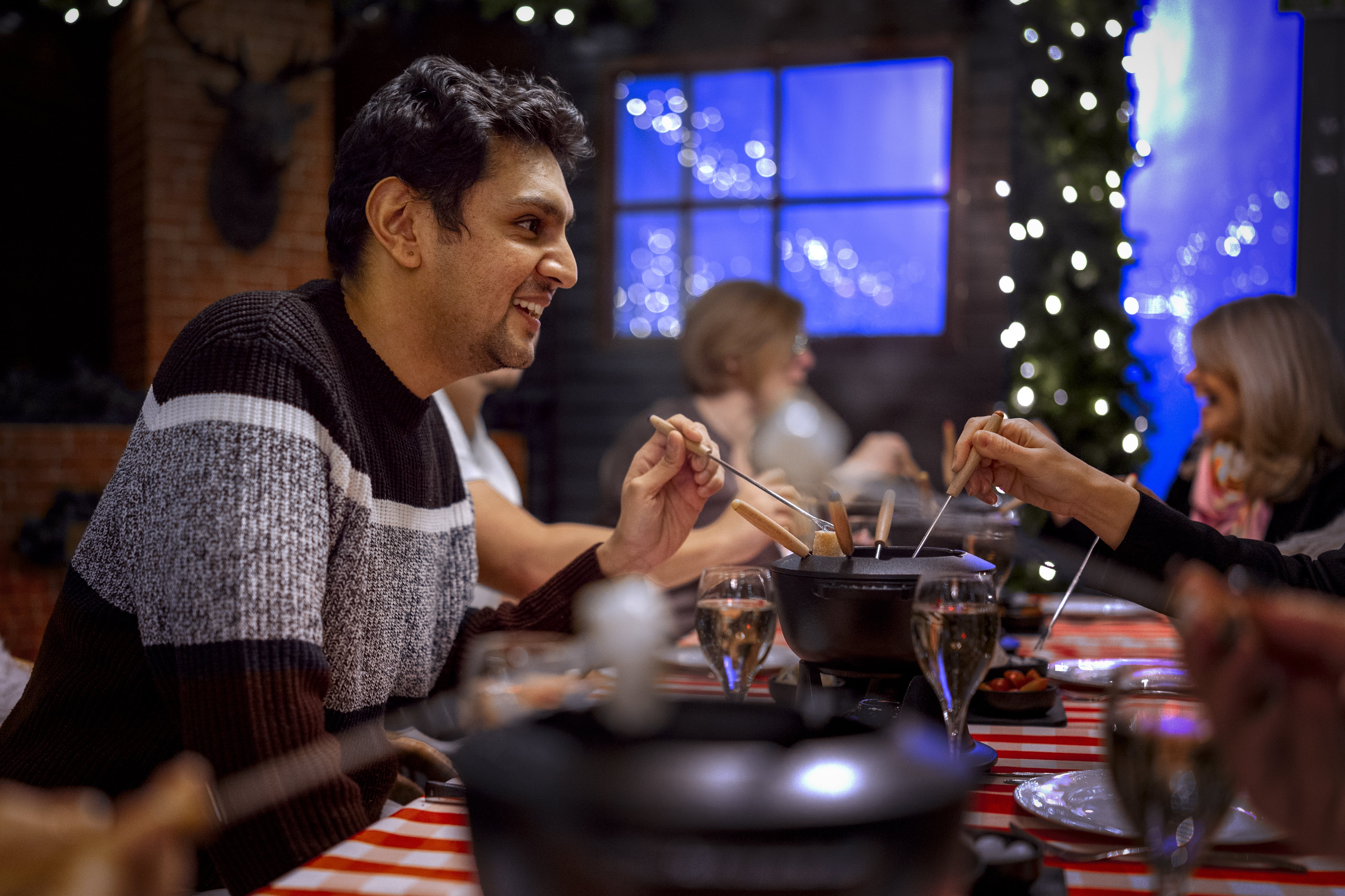 People eating fondue