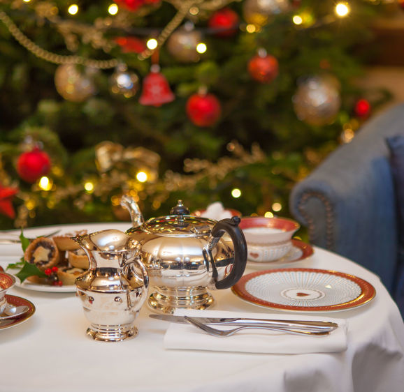 Tea and mince pies in front of a Christmas Tree Tea and mince pies in front of a Christmas Tree