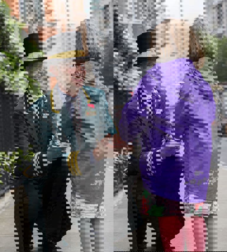 Milestone Concierge greeting a younger guest outside of the hotel Milestone Concierge greeting a younger guest outside of the hotel